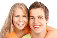 Smiling teenagers with orthodontic appliances