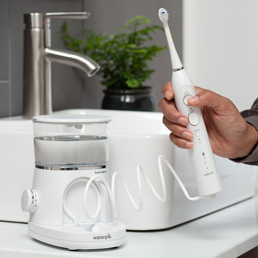 Waterpik® Sonic-Fusion®  flossing toothbrush handle buttons
