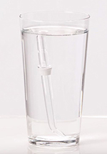Water Flosser tip soaking in white vinegar and water mixture