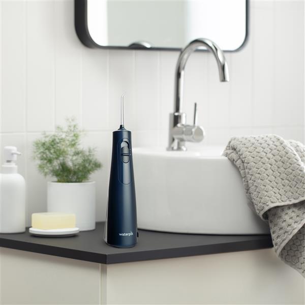 Blue Cordless Enhance Water Flosser WF-21 in Bathroom