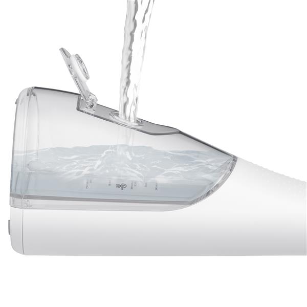 Filling the water reservoir of the White Cordless Plus 5000 handheld water flosser.