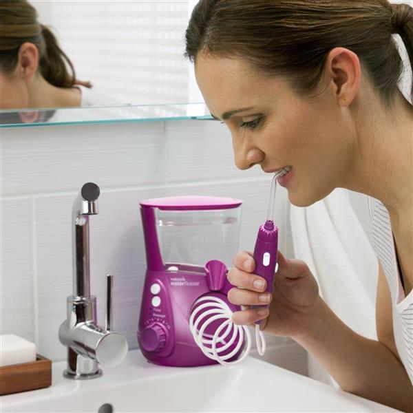 Using WP-665 Orchid Aquarius Water Flosser