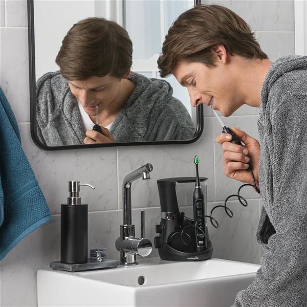 Using Black Complete Care 5.0 Water Flosser Toothbrush