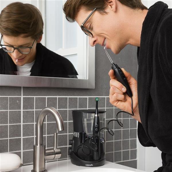 Using Black Complete Care 5.5 Water Flosser Toothbrush