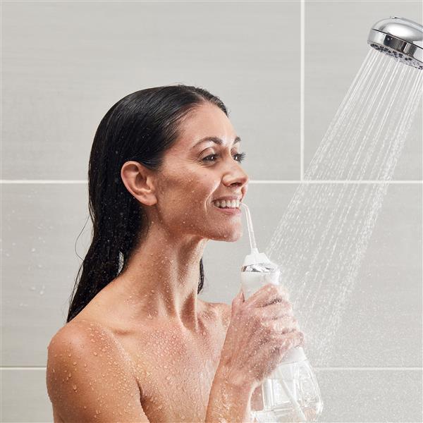 Using White Cordless Advanced Water Flosser WP-580 in Shower