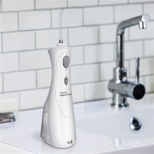White Cordless Plus Water Flosser WP-450 In Bathroom