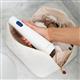 Hydropulseur portatif sans fil 1000 blanc, sans embout, sorti d’une trousse de toilette.