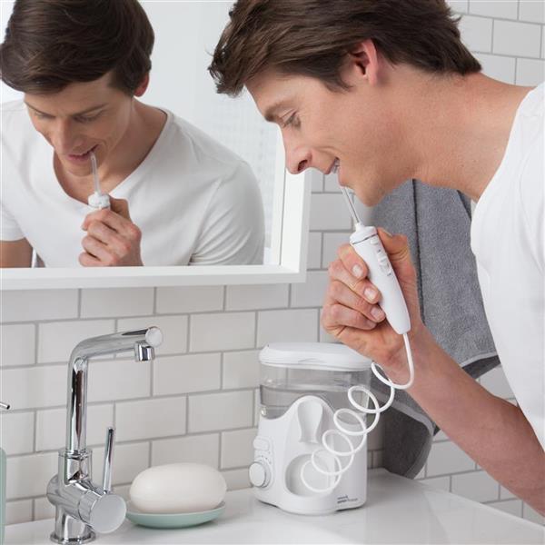 Using WF-06 White Whitening Water Flosser