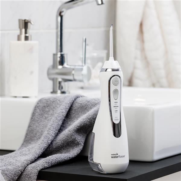 White Cordless Advanced Water Flosser WP-560 In Bathroom